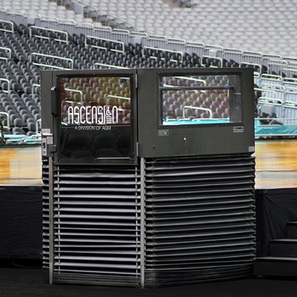 The Ascension Virtuoso wheelchair lift is seen in a basketball stadium